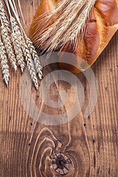 To baguettes and ears of wheat rye on vintage