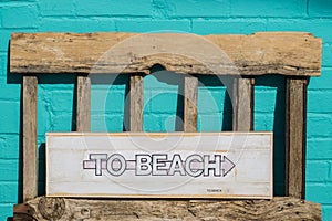 To Beach white wooden sign