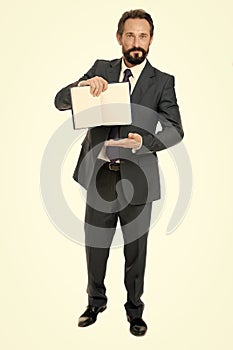 To do list. Businessman planning business schedule with notepad. Time management and organizing skill. Man bearded
