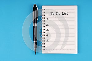 To do list text on notepad on blue background