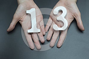 To female hands the number thirteen.