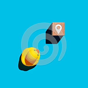 To find direction, navigation or destination in business. Rubber duckling moves towards the pin map location symbol