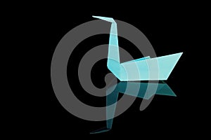 Folding paper swan, art background photo