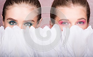 To hide the face behind the feathers. Two beautiful young women with makeup