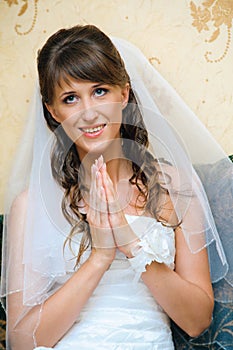 To pray bride in a white wedding dress