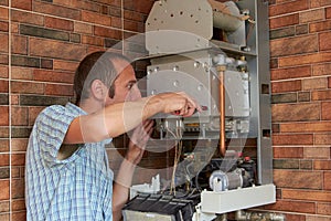 To repair a gas boiler,call a master to repair a gas boiler house