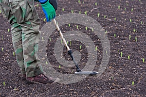 To seek treasures on earth with a metal detector