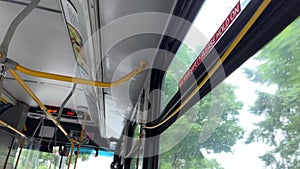 To stop Canadian buses, you need to pull rope, wire will sound stop signal, woman's hand stops bus, press sign, exit