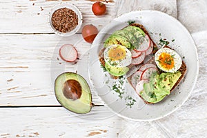 Toast with avocado, radish, egg and flax seeds