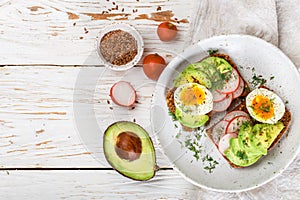 Toast with avocado, radish, egg and flax seeds