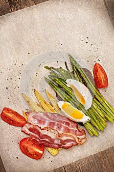 Toast with baked asparagus, boiled egg (top view)