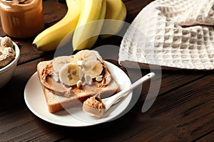 Toast bread with peanut butter and banana slices