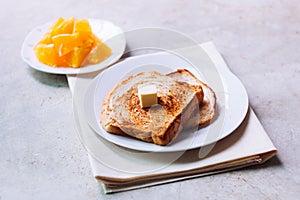 Toast bread on white plate.