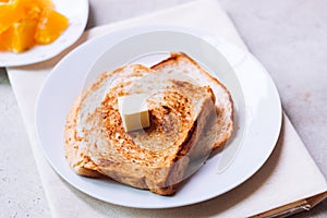 Toast bread on white plate.