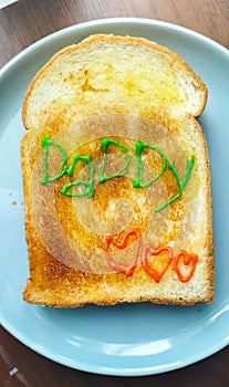 Toast with butter, draw Daddy with three hearts in family breakfast