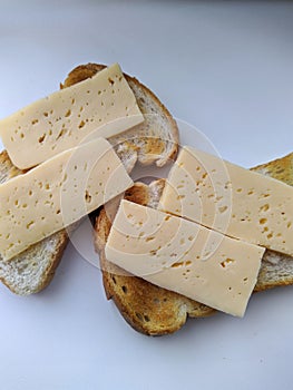 toast and cheese on white background closeup photo