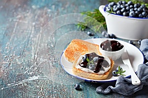 Toast with cream cheese and blueberry jam