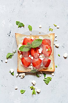 Toast with fruit strawberry, mint and cottage cheese for breakfast. Healthy breakfast, Ruddy bread toast. Traditional American and