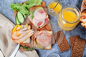Toast with meat, chicken, sausage from above different kinds bread board