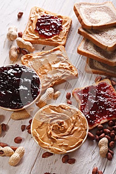 Toast with peanut butter and jelly close-up. vertical