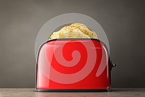 Toast popping out of Vintage Red Toaster. 3d Rendering