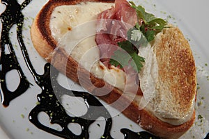 Toast with prosciutto and cheese