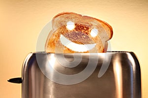 Toast with smiley face in toaster