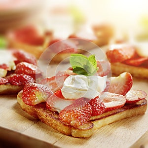 Toast with strawberries mascarpone and lemon and a garnish