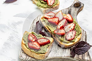 Toast with strawberry guacamole. and chia seeds. Keto diet toast. Delicious breakfast or snack, Clean eating, dieting, vegan food