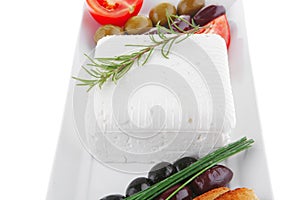 Toast and vegetables with feta cube