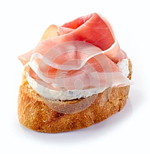 Toasted bread with cream cheese and prosciutto