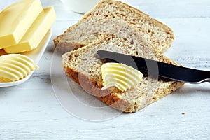 Toasted bread with fresh butter curls. margarine or spread, natural dairy product on breakfast bread