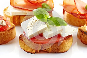 Toasted bread with fresh goat cheese and tomato