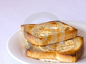 Toasted bread fried with egg inside.