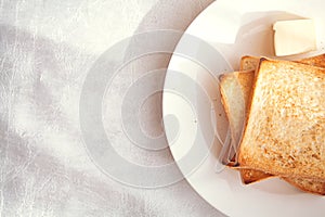 Toasted bread slices with butter pat for breakfast