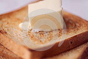 Toasted bread slices with butter pat for breakfast