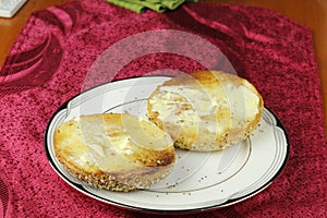 Toasted and Buttered Everything Bagel on a Plate