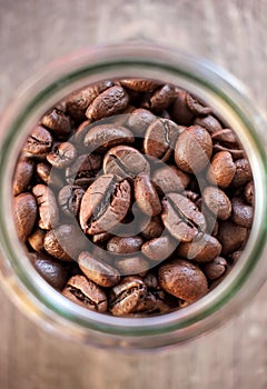 Toasted coffee beans in a glass jar