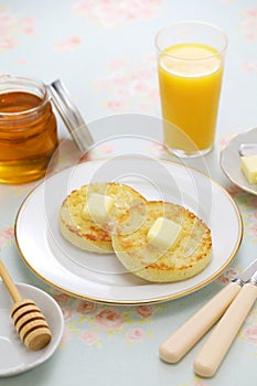 Toasted homemade crumpets with butter