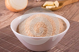 Toasted manioc flour into a bowl