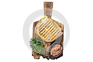 Toasted Panini sandwich with Prosciutto ham and cheese. Isolated, white background.