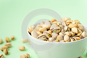 Toasted pistachios in a bowl. Nuts vegan protein