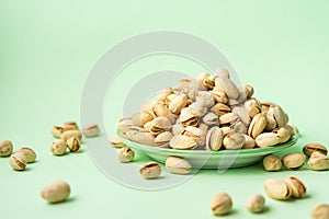 Toasted pistachios in a plate. Nuts vegan protein