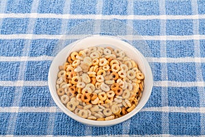 Toasted Round Oat Cereal in White Bowl