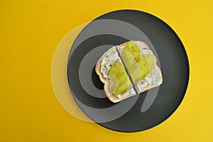 Toasted rustic white bread with a sour cream and chives spread