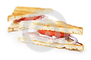 Toasted sandwich with ham, cheese and vegetables