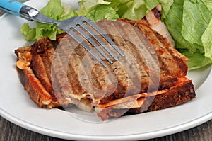 Toasted sandwich served on a plate with salad