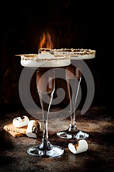 Toasted smores martini with chocolate liquor, cream, marshmallow and graham cracker rim.