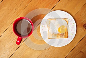 Toaster bread with half boiled egg and coffee