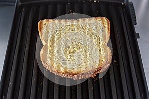 Toastie on a grill close-up view photo